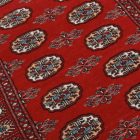 Tapis Pakistan bordeaux Boukhara 92x152 tapis oriental fait main